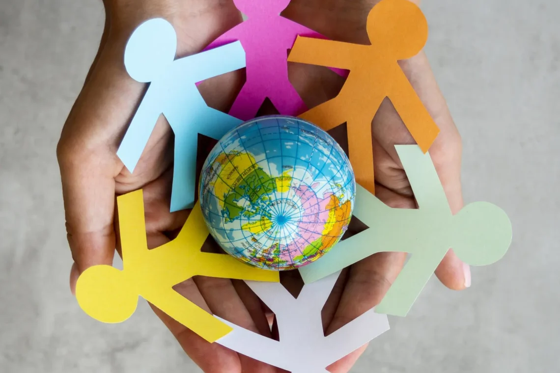 top-view-origami-chain-people-with-globe